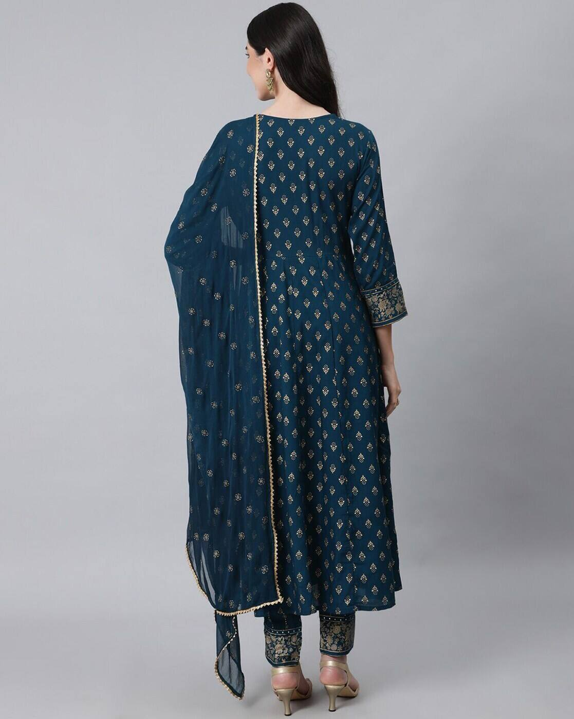 Back view of model wearing three piece Chinnon Anarkali Kurta Set Canada in teal with gold motifs, dupatta and pants