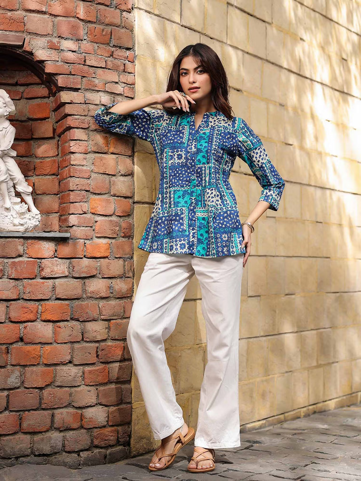 Aromie fusion wear Indian jumpsuit for women styled as blue patterned tunic with white palazzo pants