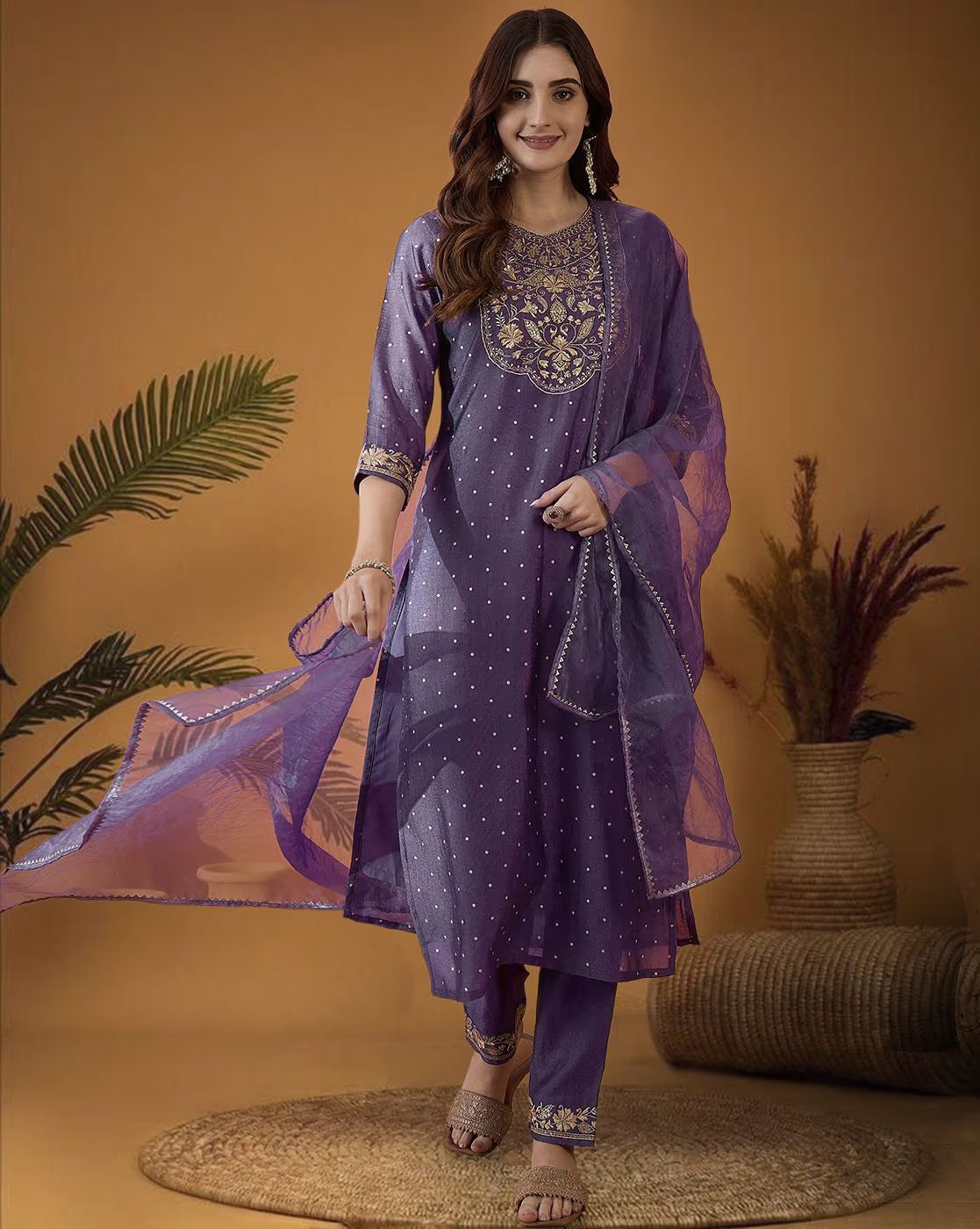 Elegant three piece kurta set in purple with intricate embroidery and stylish dupatta