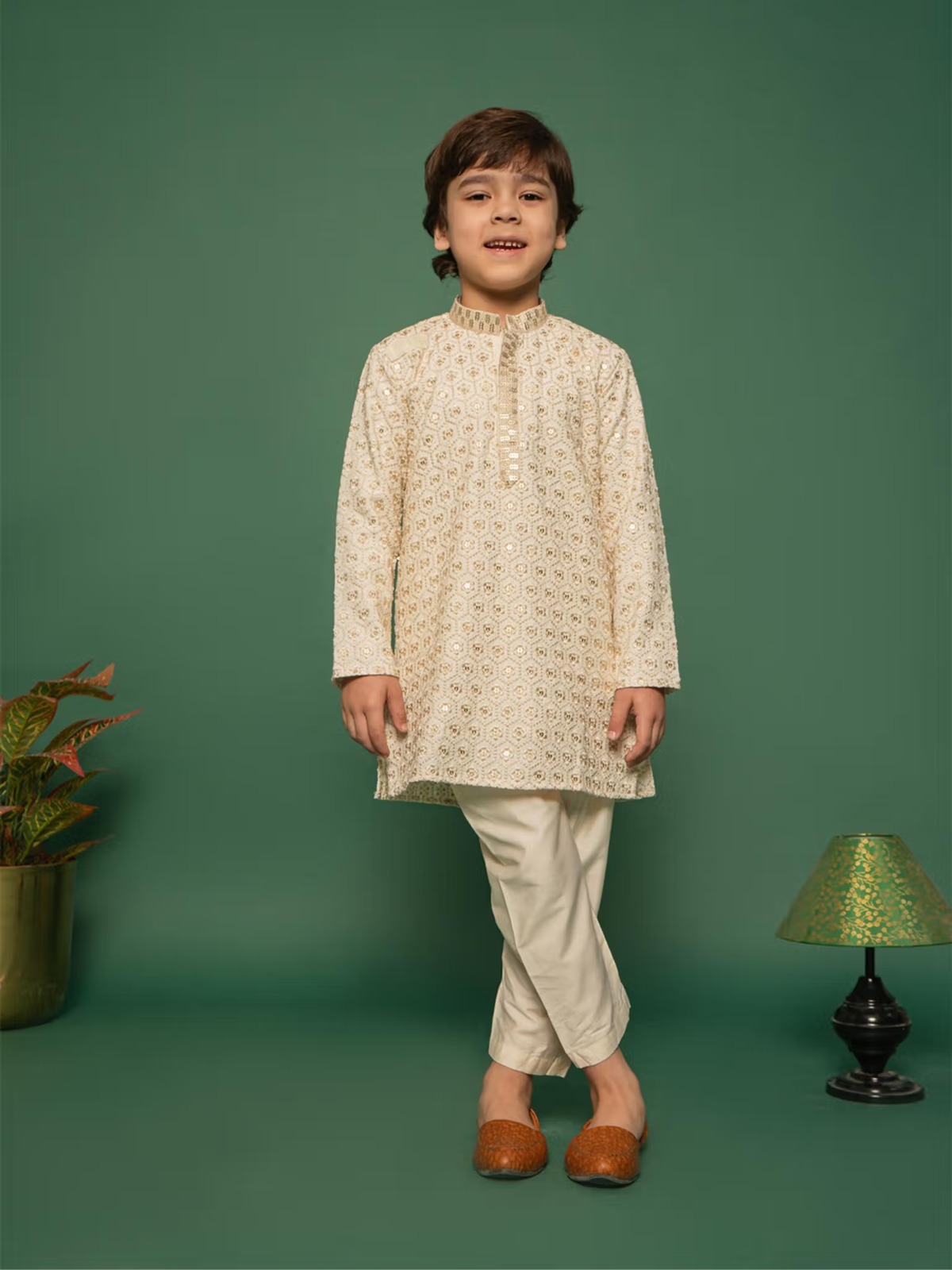 Young boy wearing boys off white kurta pyjama set Canada embroidered kurta with matching pyjama and brown mojari shoes
