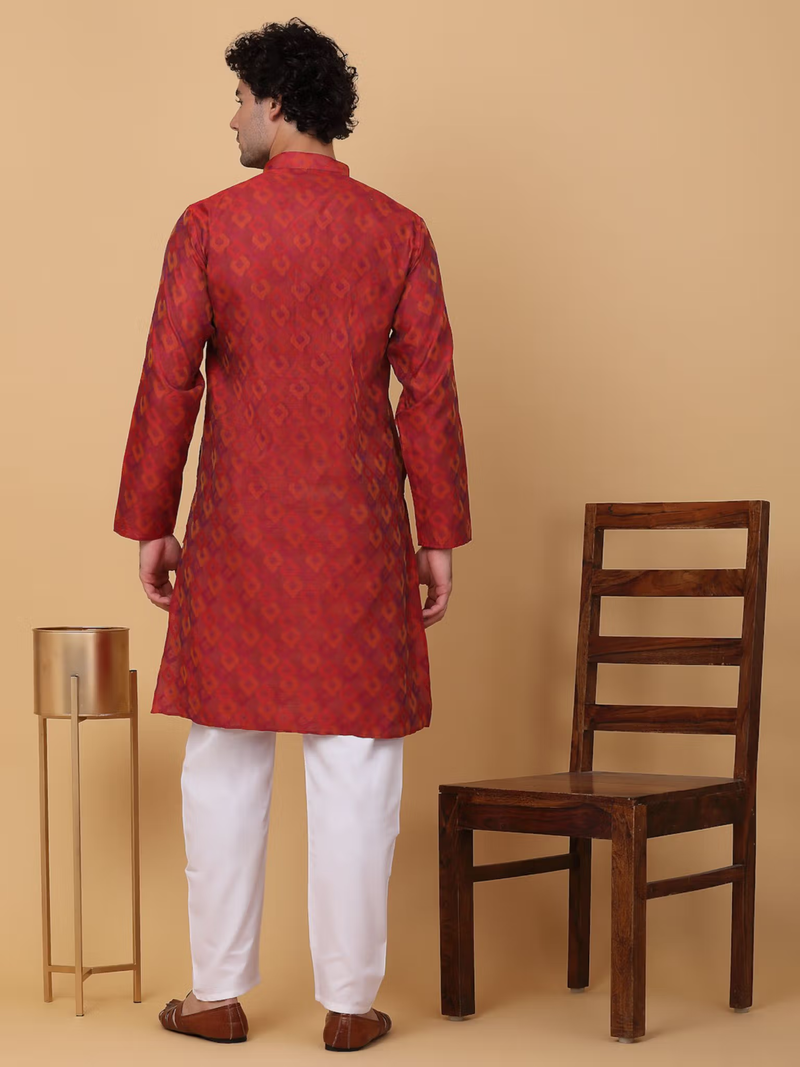 Back view of model in men maroon silk kurta pajama set patterned kurta with white pajamas and brown shoes