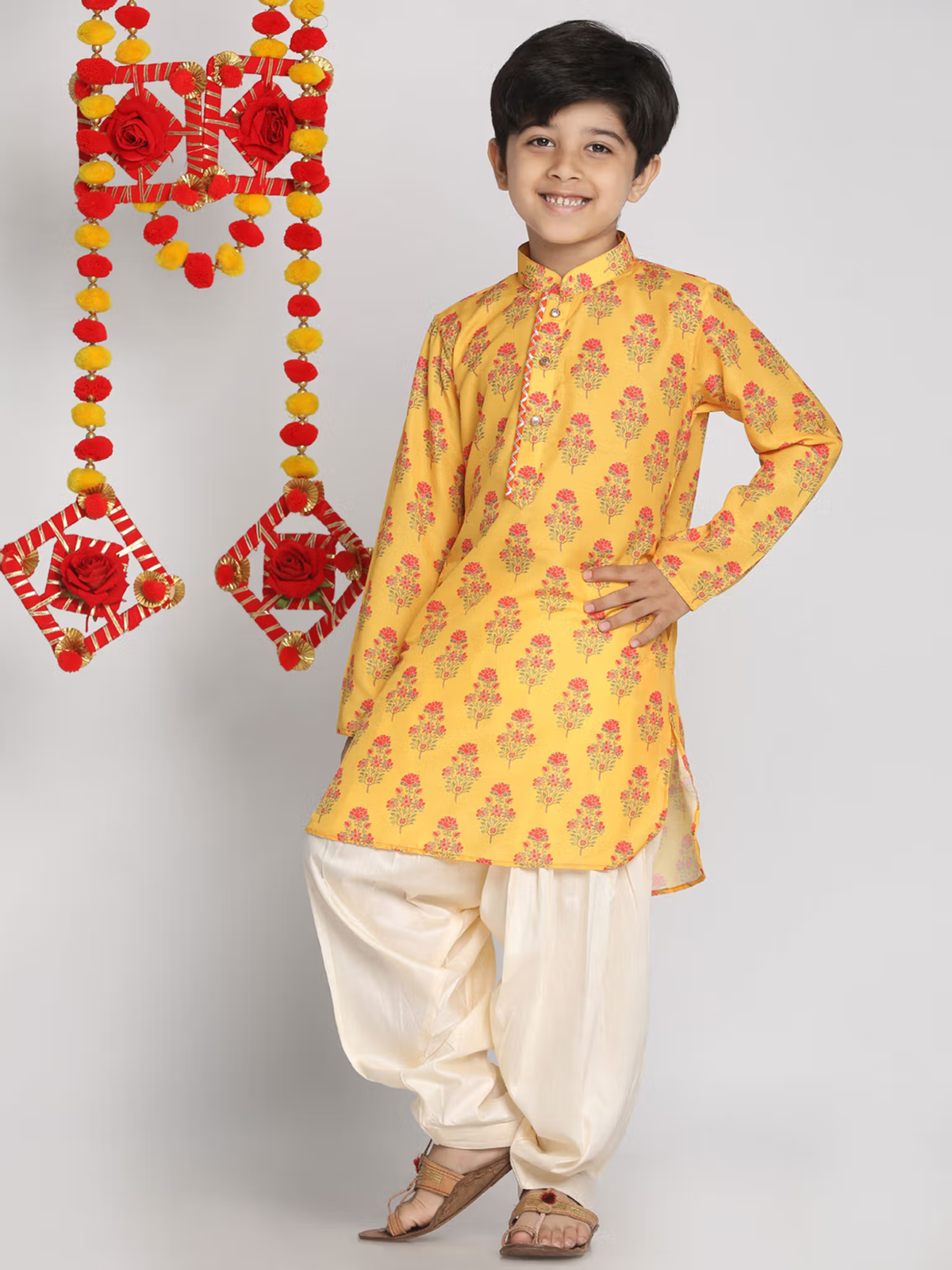 Smiling boy wearing yellow floral kurta and cream Patiala pants traditional outfit AROMIE boys kurta patiala set Canada