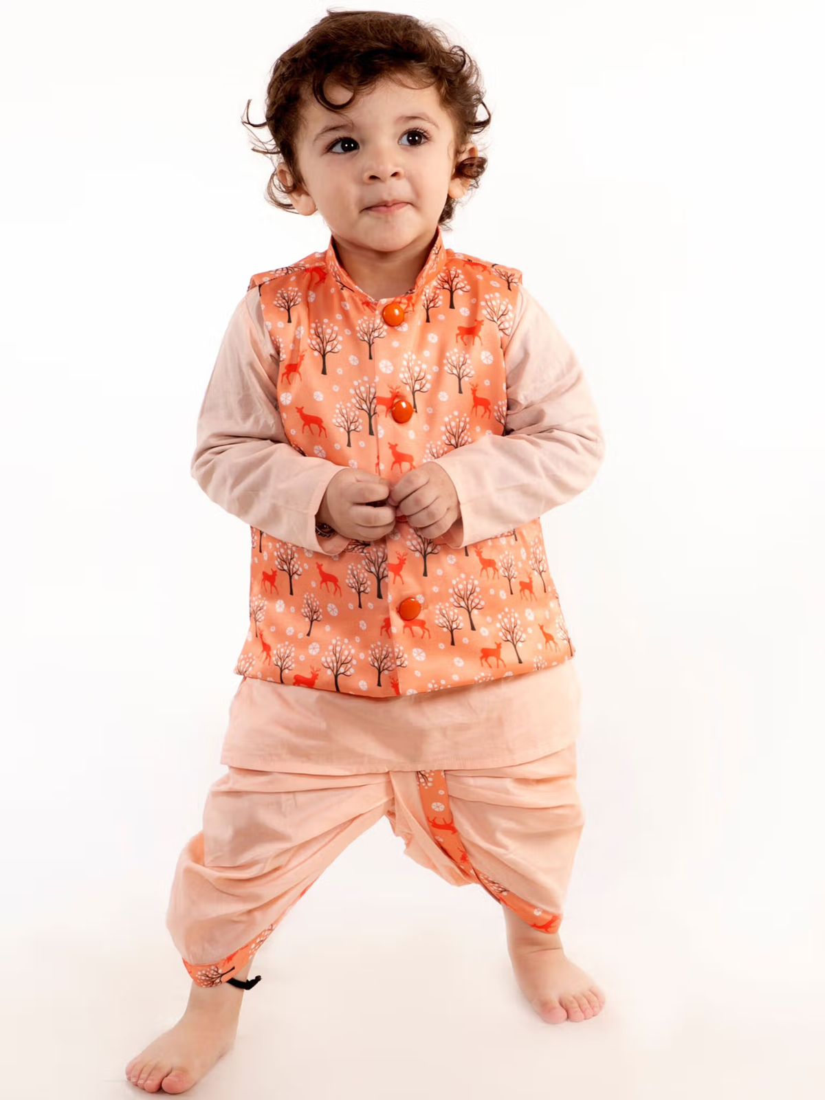 Toddler boy wearing boys peach kurta dhoti jacket set with printed tree pattern jacket and peach dhoti