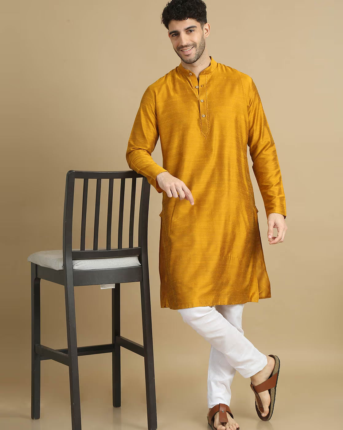 Stylish men's cotton kurta pyjama set in mustard, perfect for festive occasions.