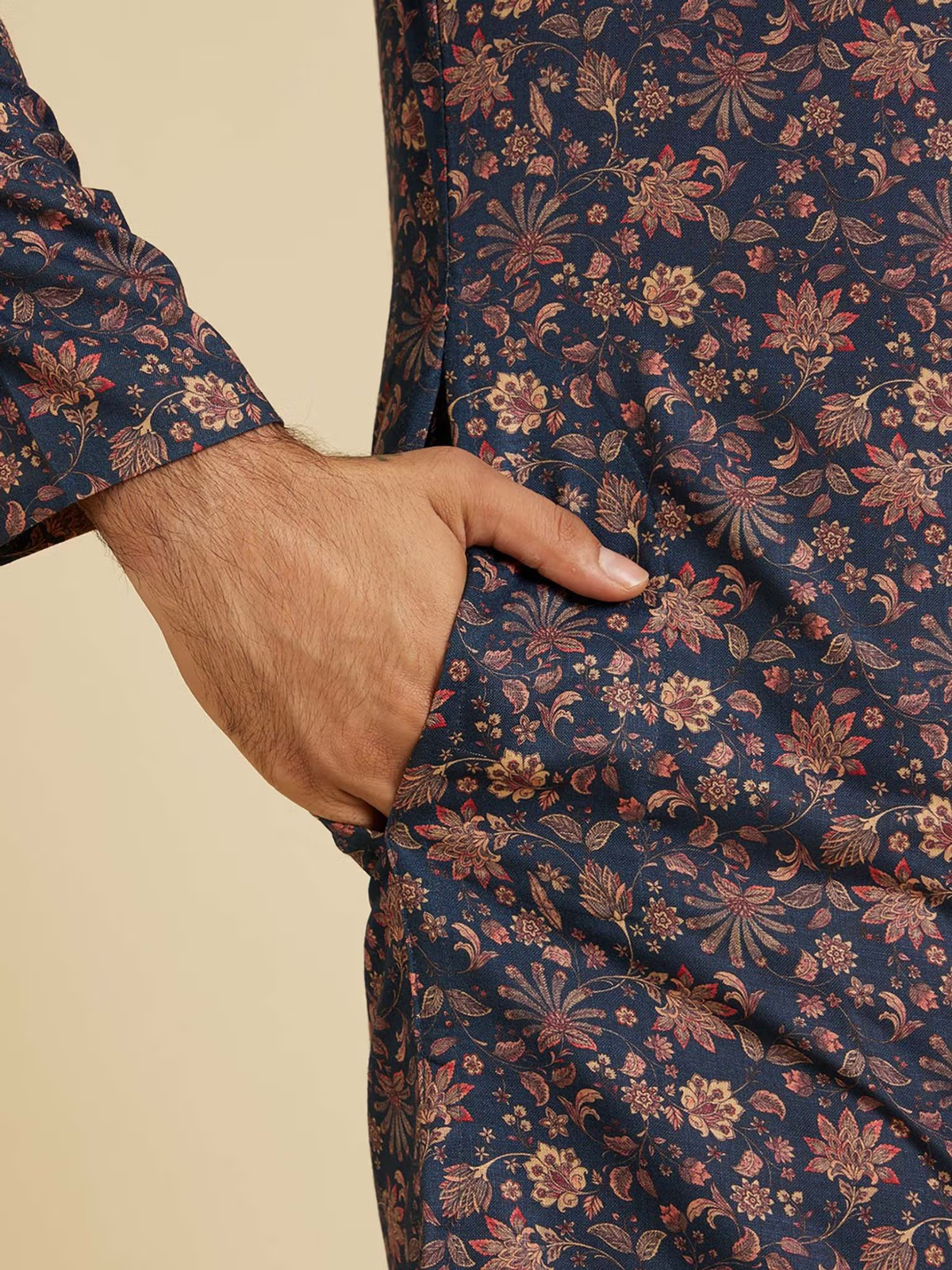 Close up of Mens Kurta with hand in pocket showcasing intricate floral print on blue floral kurta pyjama set