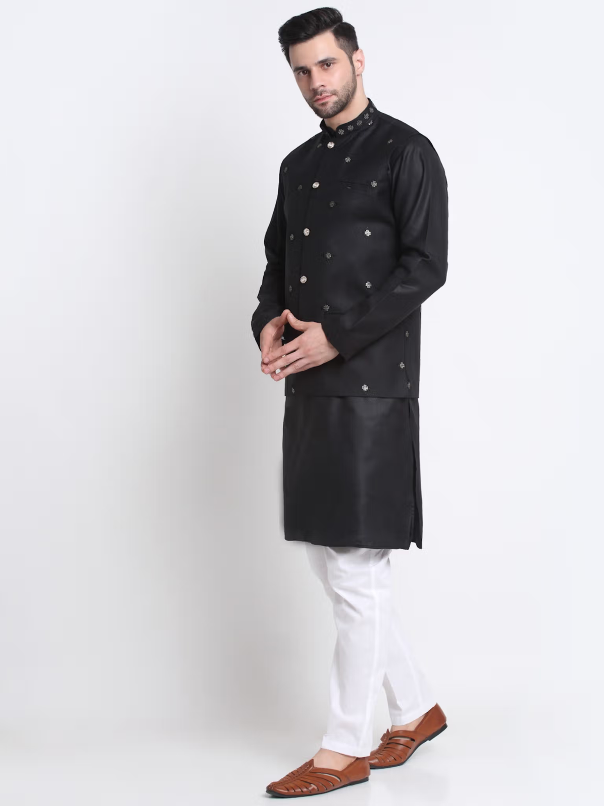 men's black kurta pajama nehru jacket set on model with white pants and brown leather loafers