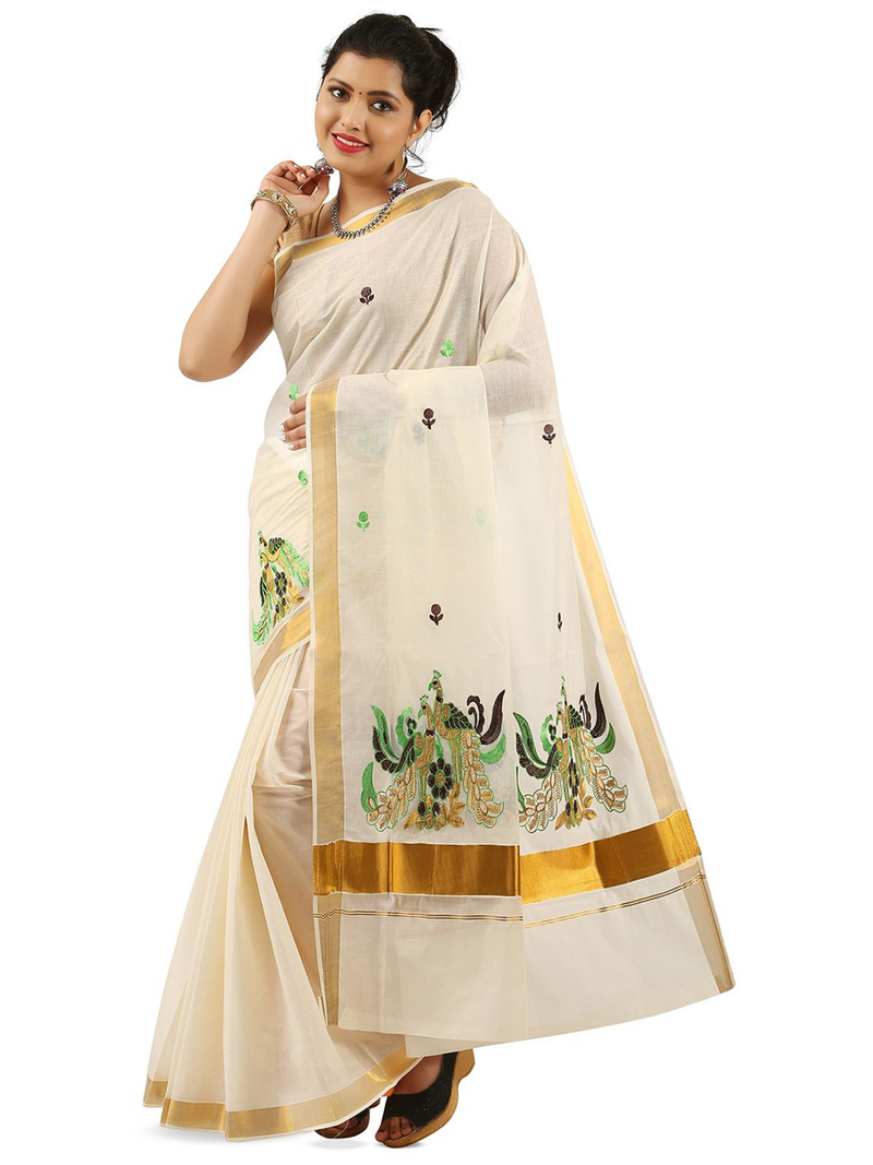 Aromie rose gold mirror work saree in cream with green and gold embroidered details worn by a woman