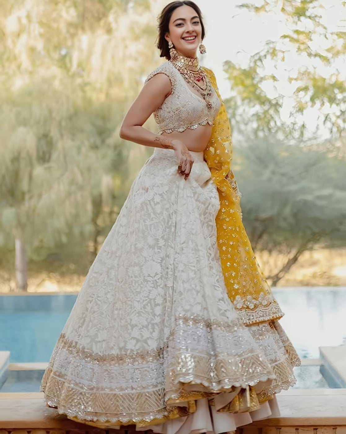 women embellished lehenga choli set white embroidered lehenga with gold detailing and yellow dupatta