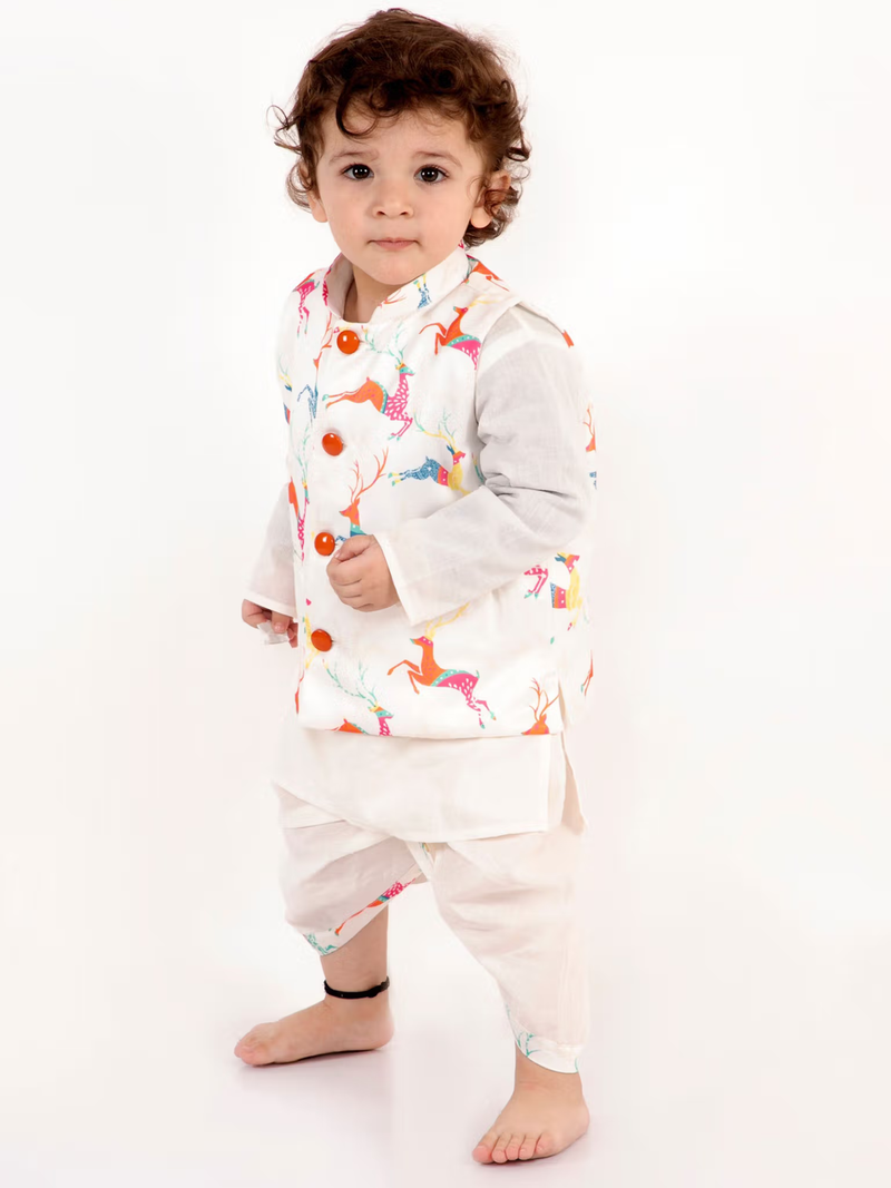 Toddler wearing boys white kurta dhoti jacket set with colorful animal print Nehru jacket and wooden buttons