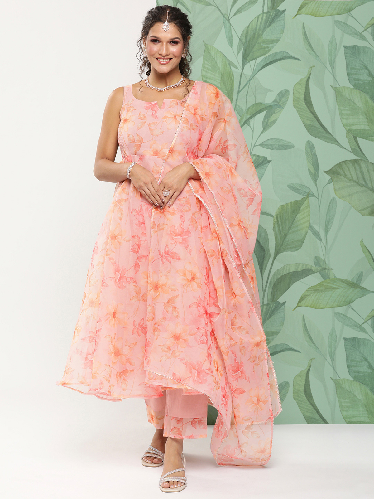 Aromie embroidered cotton kurta set in peach floral three piece design with sleeveless kurta dupatta pants