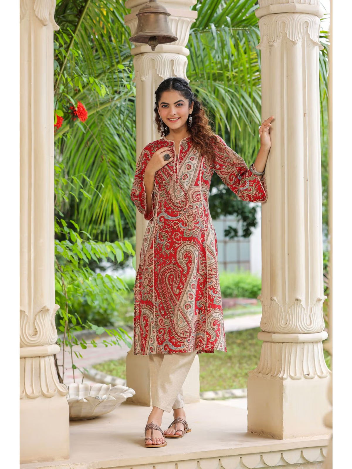 Aromie red paisley single piece kurta worn by model with beige pants floral rayon jumpsuit for women