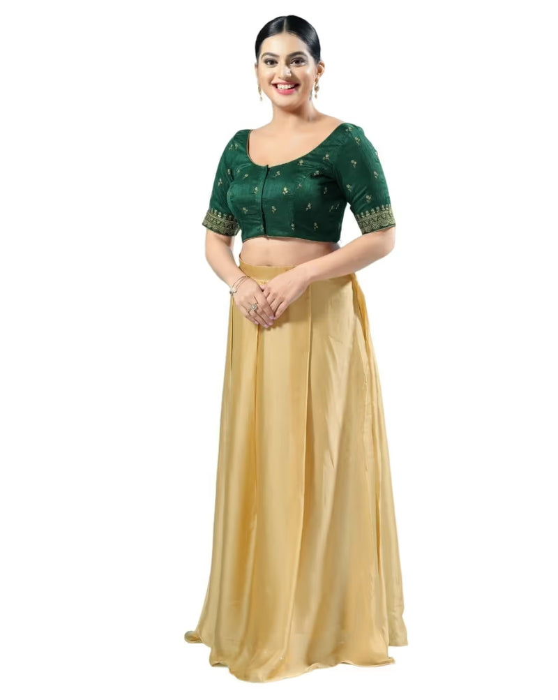 Woman wearing a green blouse and beige skirt on a white background