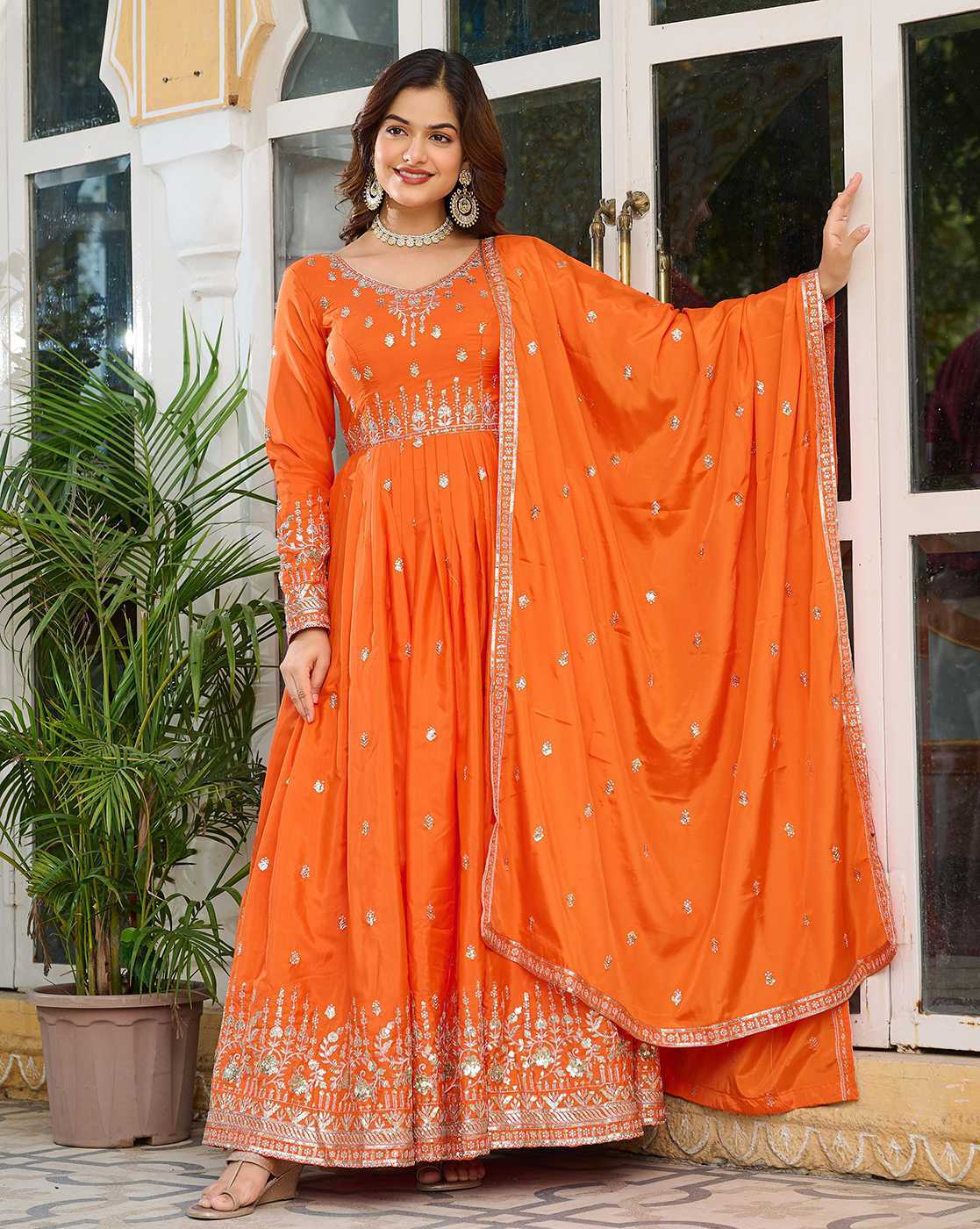 Aromie orange embroidered Georgette Anarkali Kurta Set three piece with dupatta on model