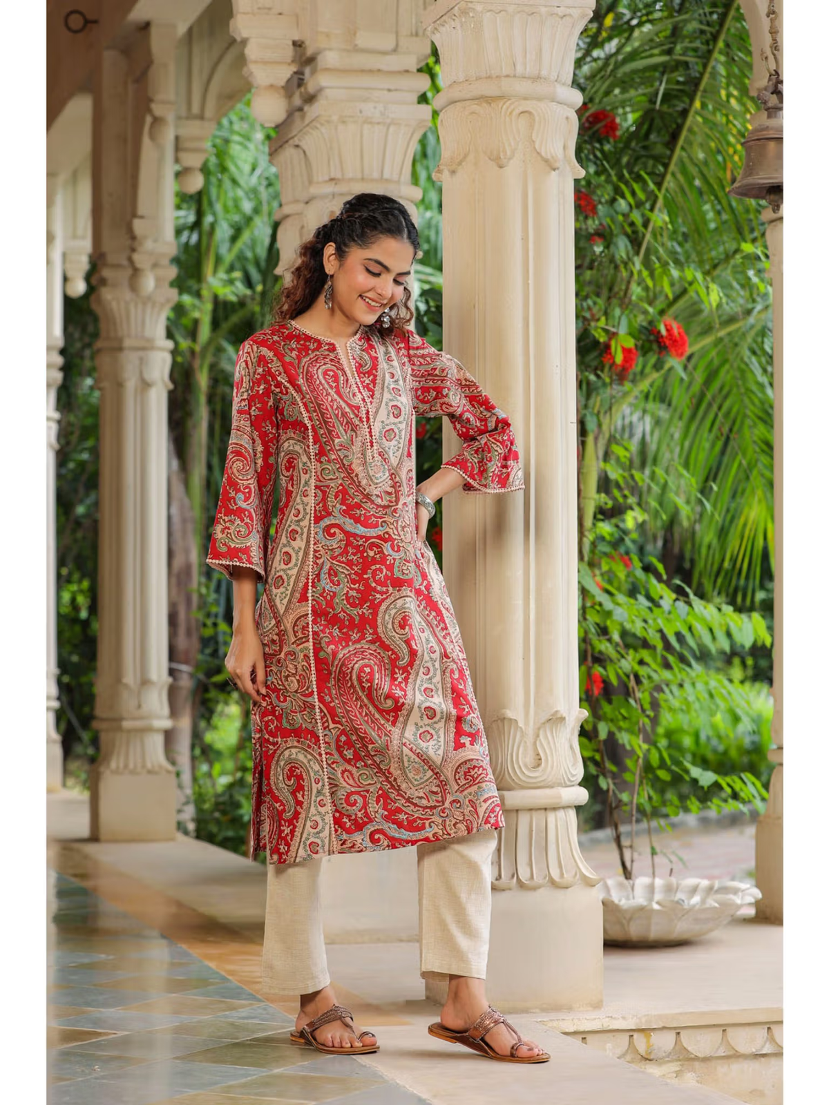 aromie single piece kurta in red paisley print with cream pants styled like floral rayon jumpsuit for women