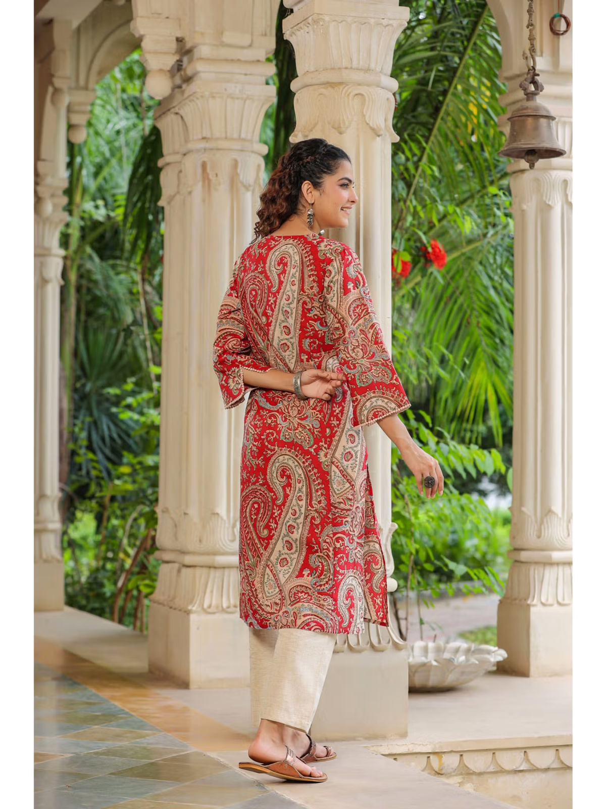 Aromie red paisley single piece kurta with side slits modeled by woman by pillars floral rayon jumpsuit for women