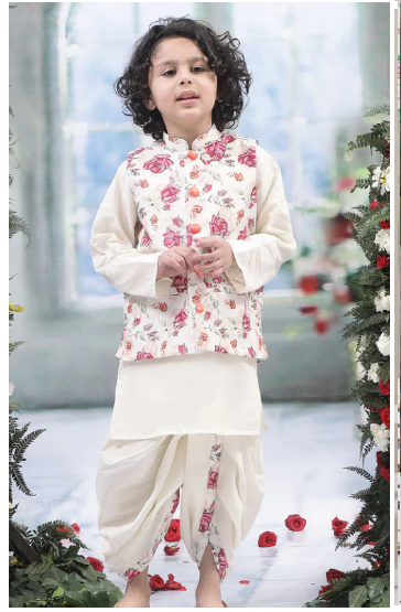 Child wearing a floral outfit with a blurred decorative background