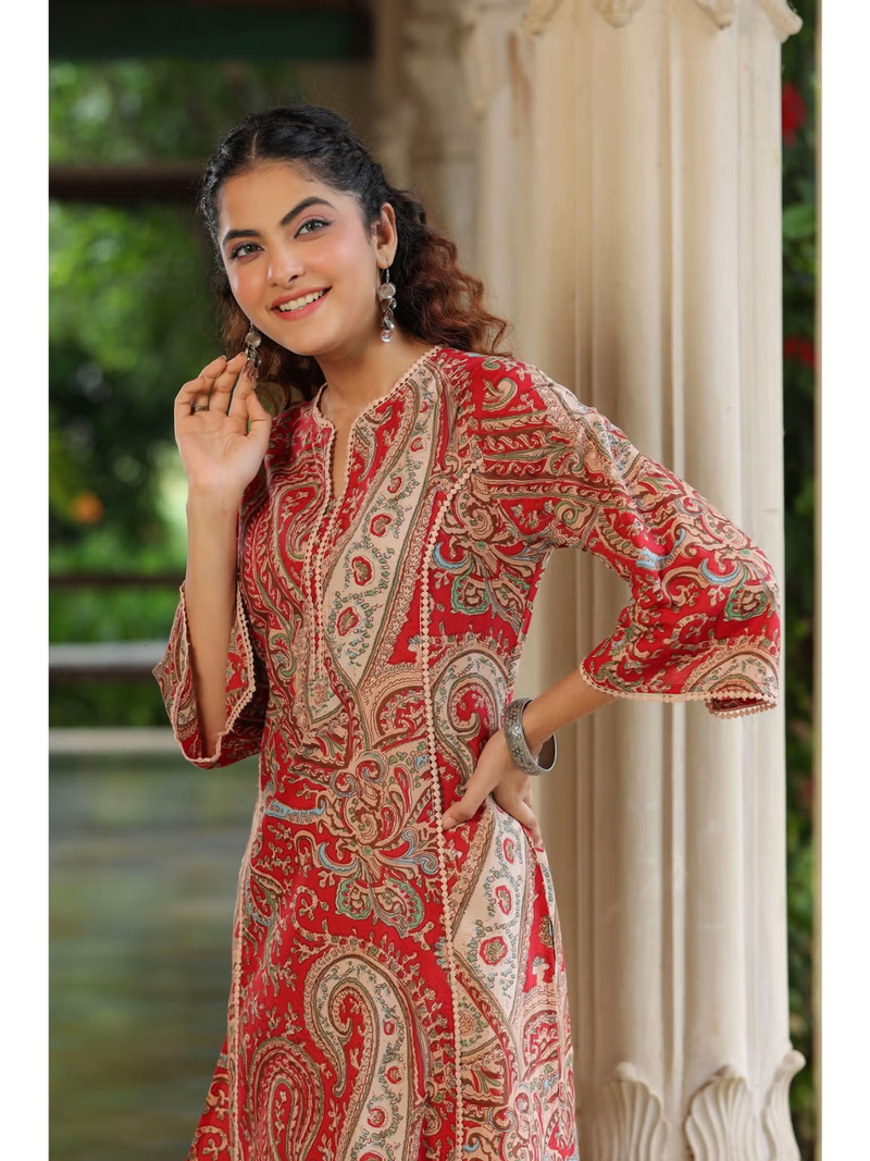 aromie floral rayon jumpsuit for women shown as red paisley single piece kurta with three quarter sleeves and earrings