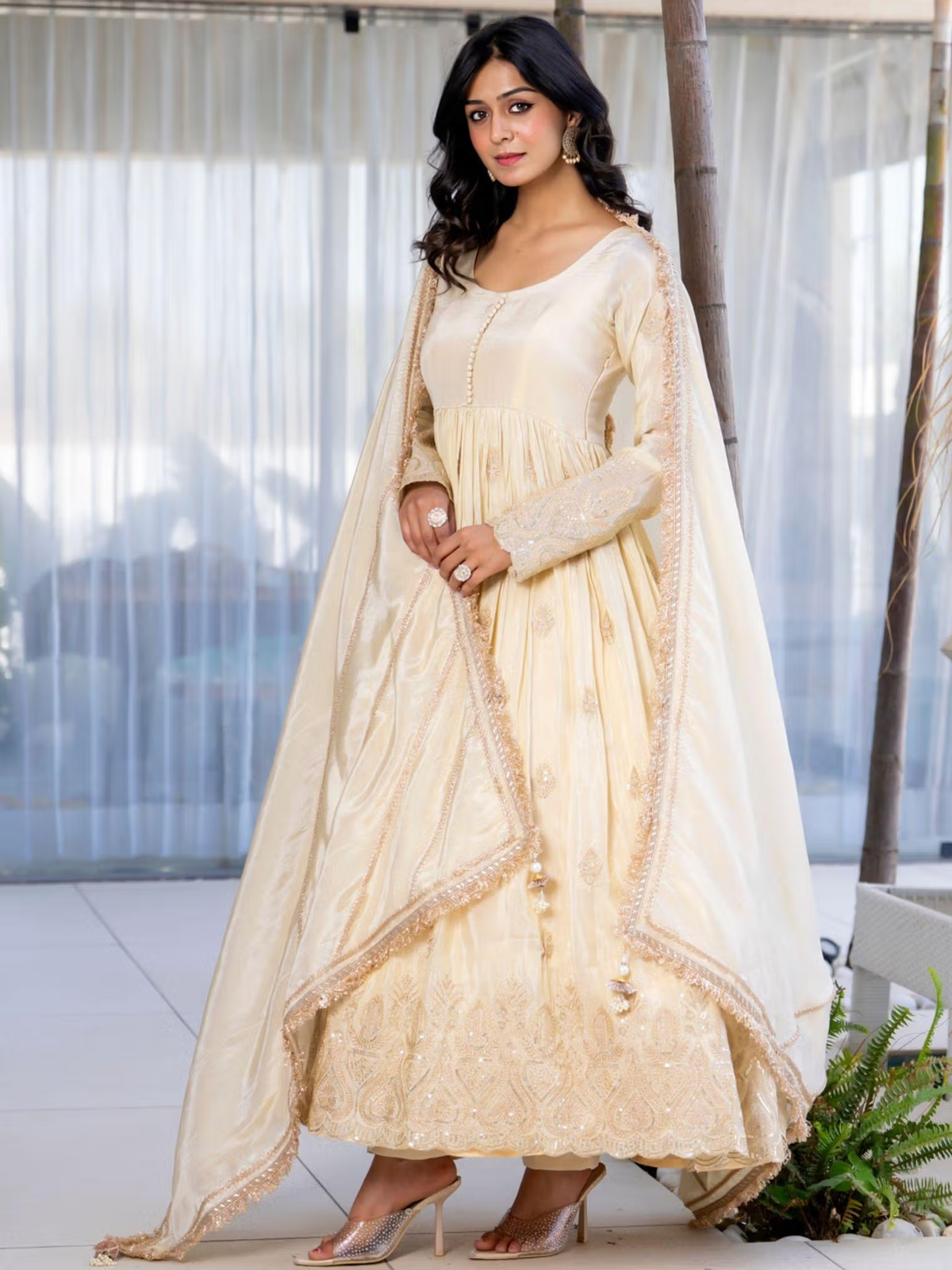 Aromie cream three piece kurtha with embroidery and dupatta model wearing floor length outfit bright red floral co-ord set