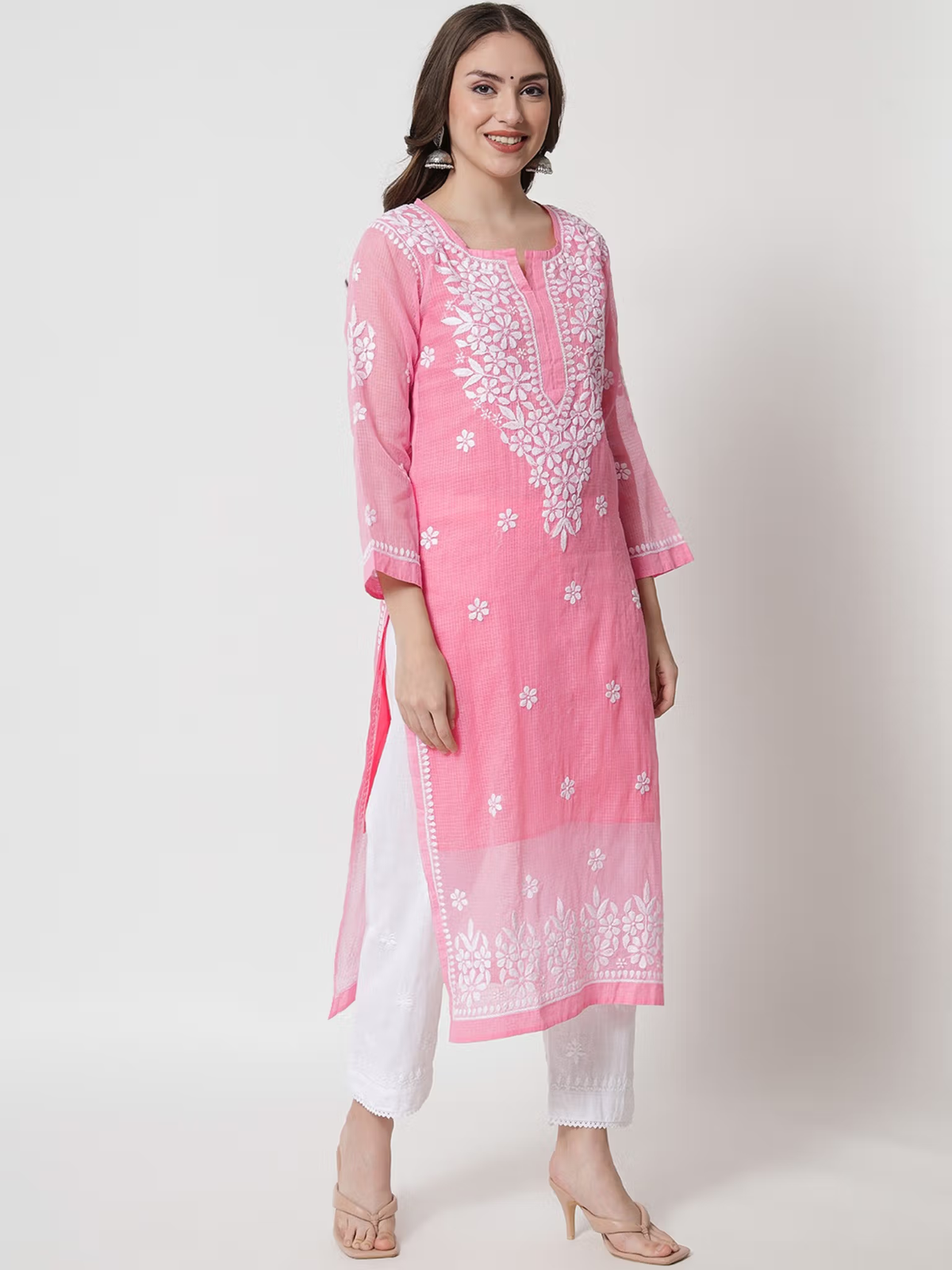 Aromie pink embroidered single piece kurta with white pants styled like a printed viscose jumpsuit for casual wear