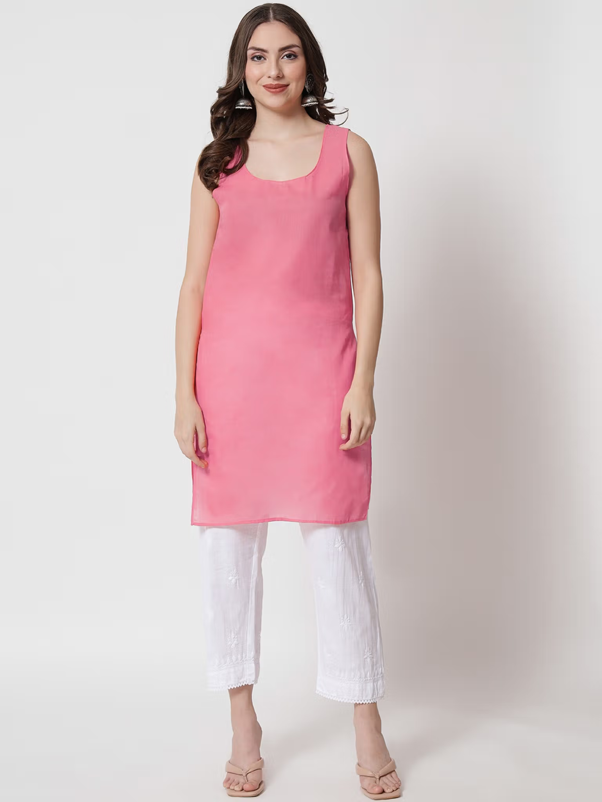 Aromie sleeveless pink single piece kurta styled with white cropped pants for casual wear printed viscose jumpsuit