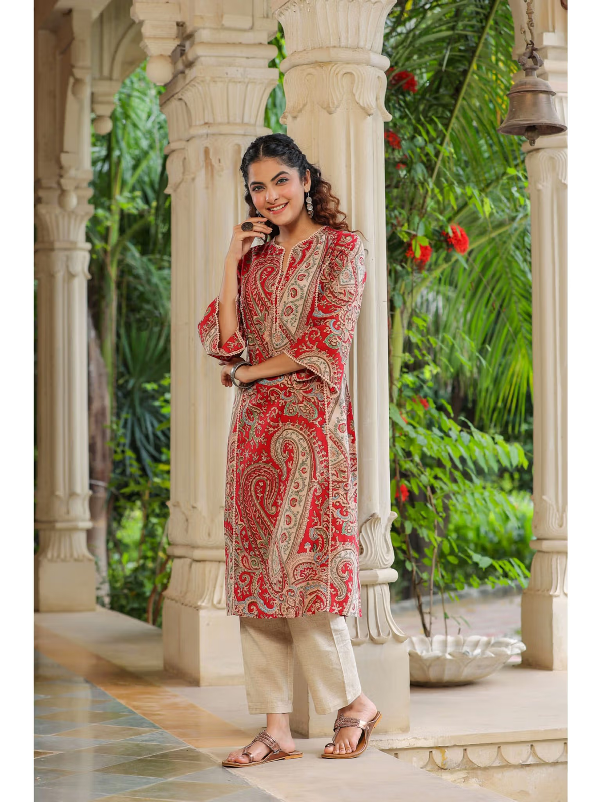 aromie red paisley single piece kurta with beige pants worn by smiling model floral rayon jumpsuit for women