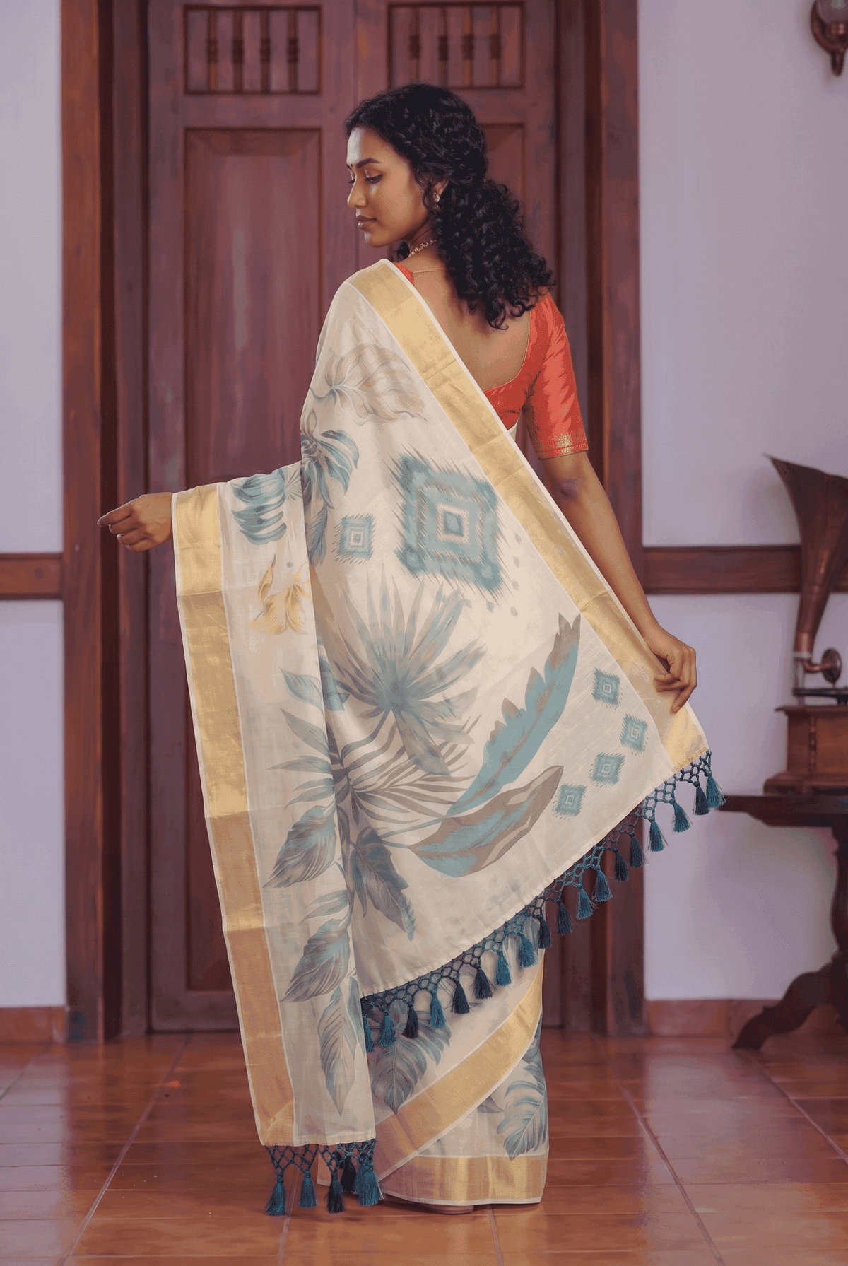 Cream Tissue Kasavu Onam Saree with Teal  and Tropical Leaf Print