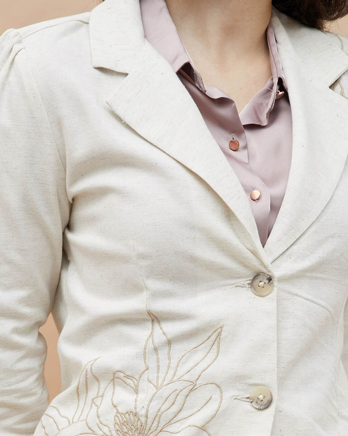 Front view of embroidered button closure jacket for women – elegant and tailored