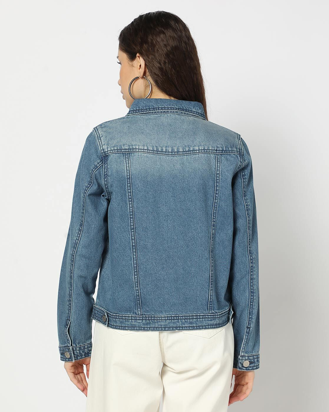 Front view of lightly washed denim jacket for women – relaxed fit and beige cotton