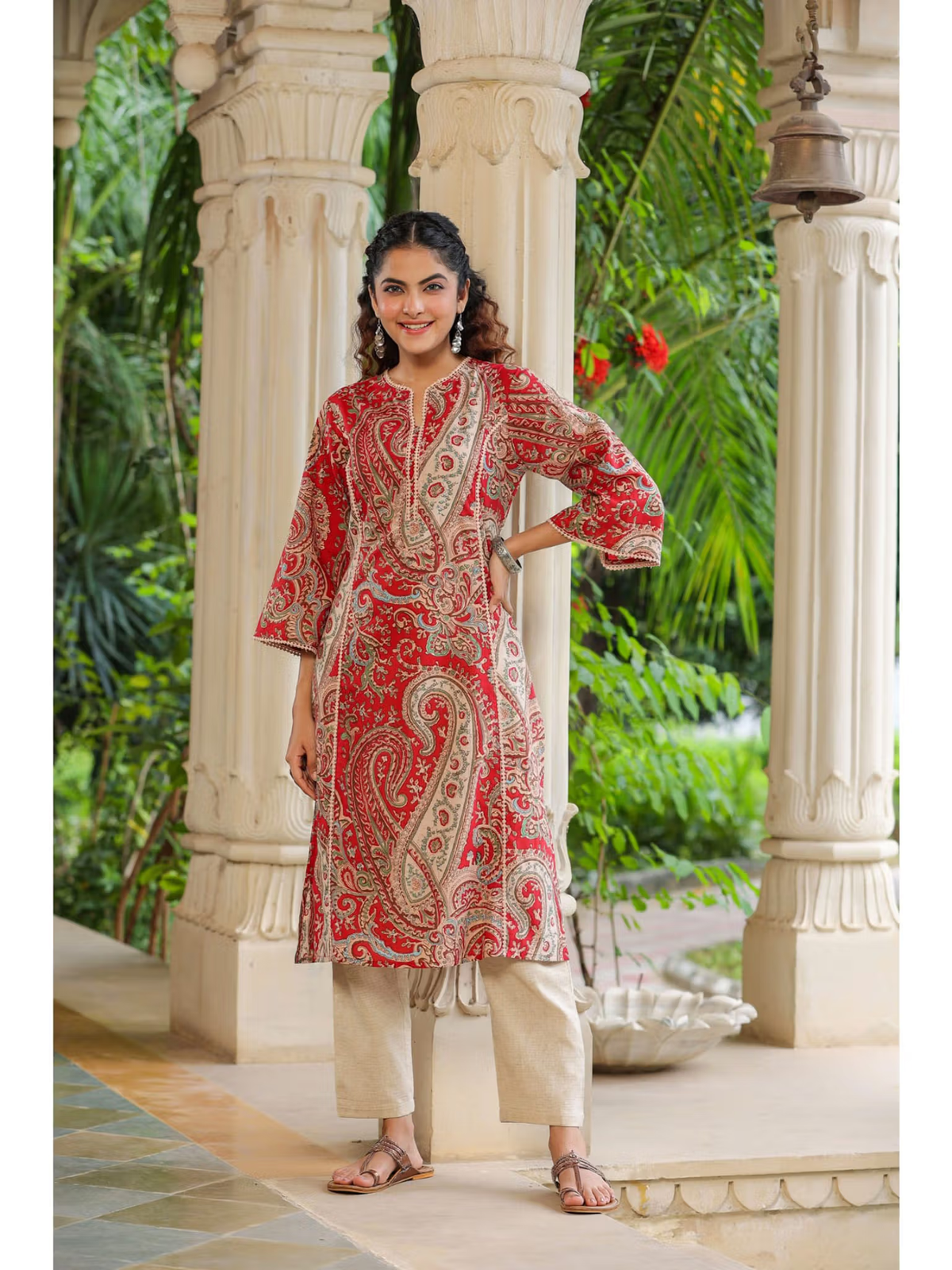aromie red printed kurta with beige pants on model in archway setting floral rayon jumpsuit for women