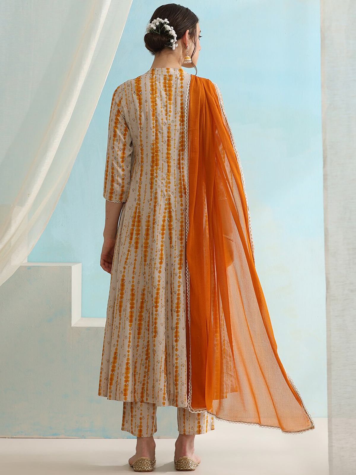 Three piece Kurtha set in cream with orange accents for affordable ethnic wear Canada