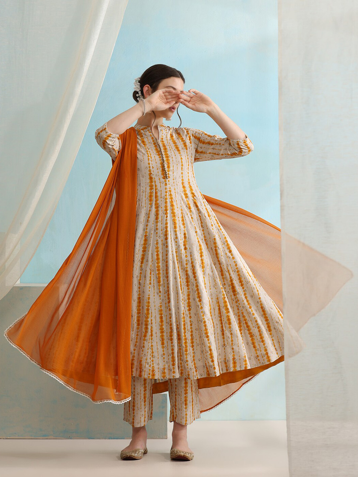 Three piece Kurtha in orange and white for women, ideal for affordable ethnic wear Canada