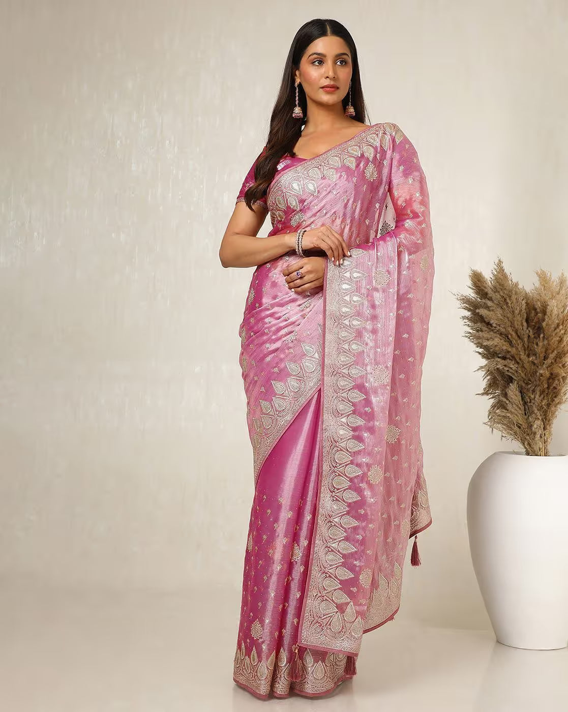Front view of a pink affordable silk saree Canada with intricate silver detailing, perfect for weddings or festive occasions.