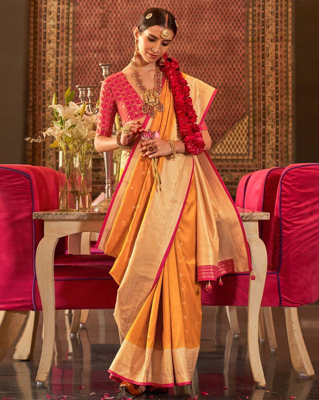 Elegant model wearing an affordable woven silk saree with intricate details and a vibrant color combination