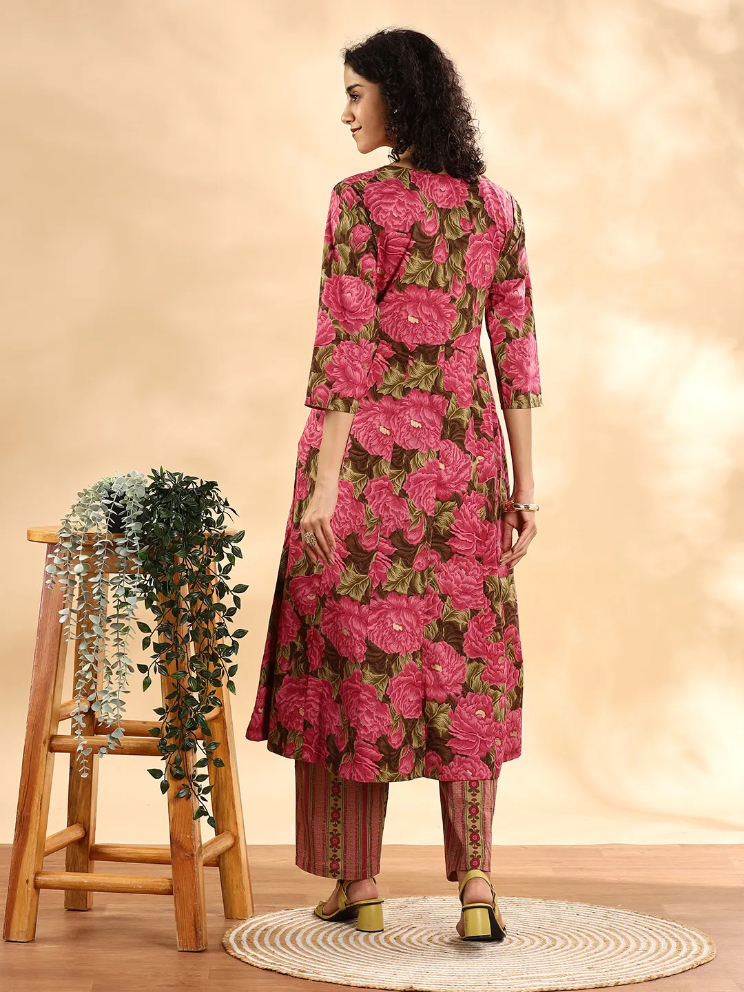 Aromie Anarkali Kurta Set Canada in vibrant pink floral print, perfect for festive occasions, showcased from the back.