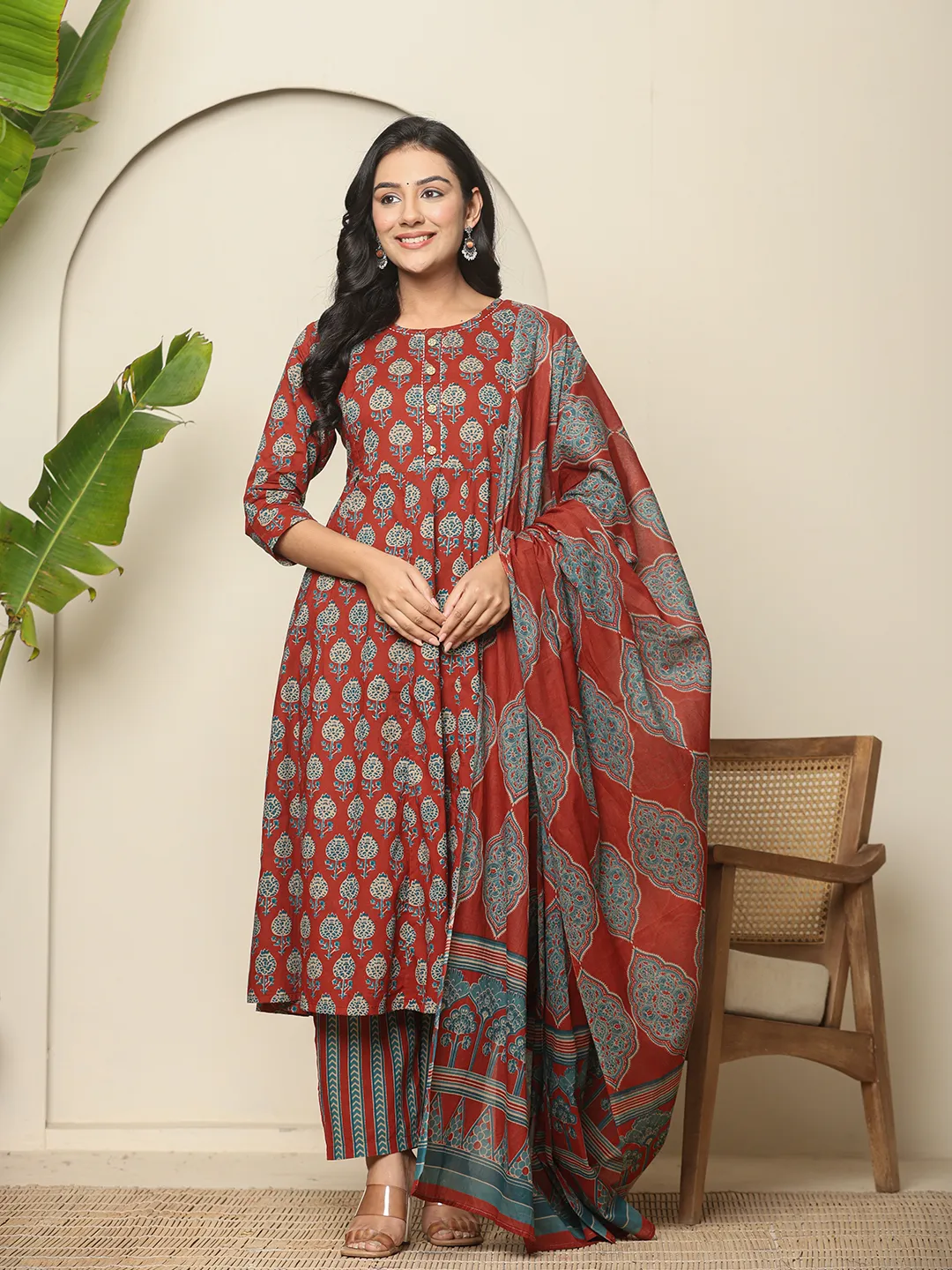 Three piece Anarkali Kurta Set Canada in maroon with intricate patterns, perfect for festive occasions.