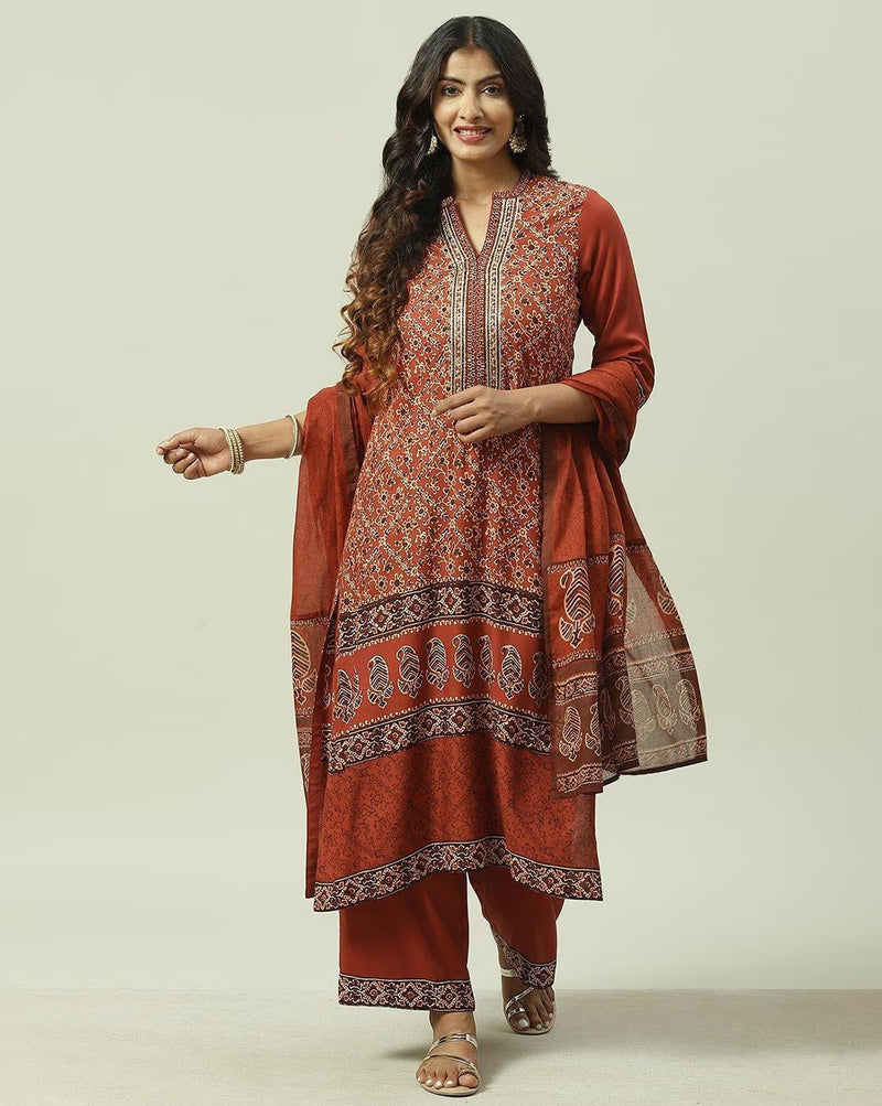Three piece Angrakha Anarkali Kurta Set in rust color with embroidered details, ideal for casual and festive occasions