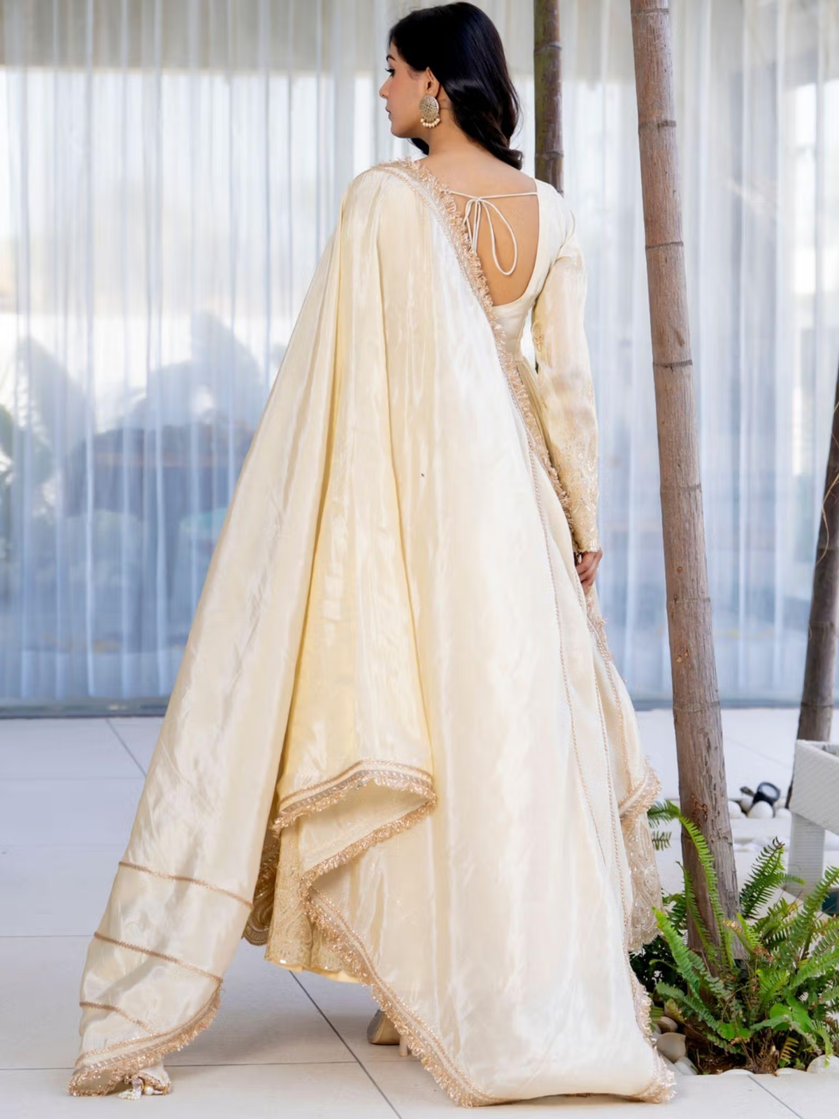 aromie three piece kurtha ivory back view with flowing dupatta and intricate embroidery bright red floral co-ord set