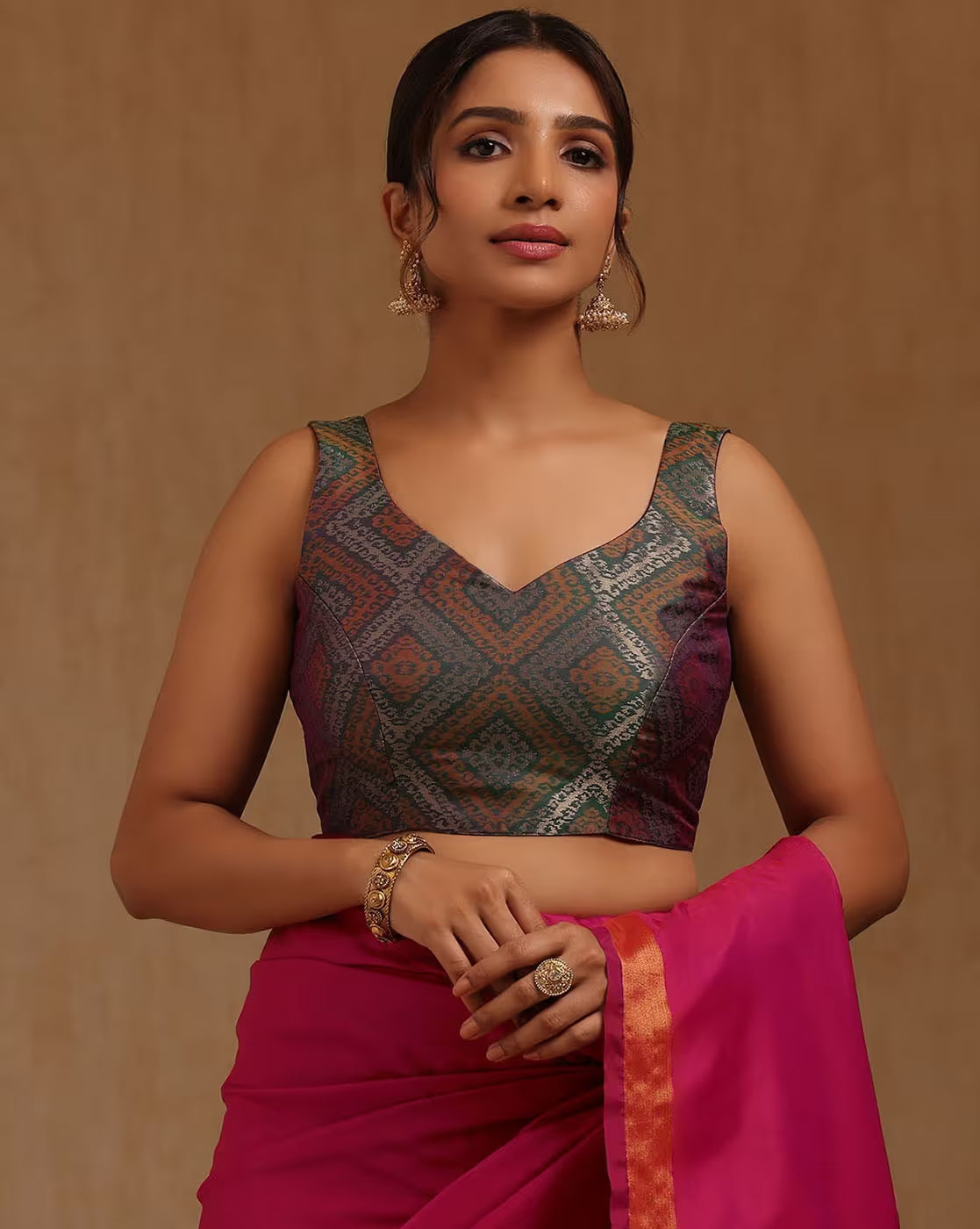 Front view of a vibrant Banarasi Kanjivaram Silk Saree USA in pink and green, perfect for weddings and festive occasions