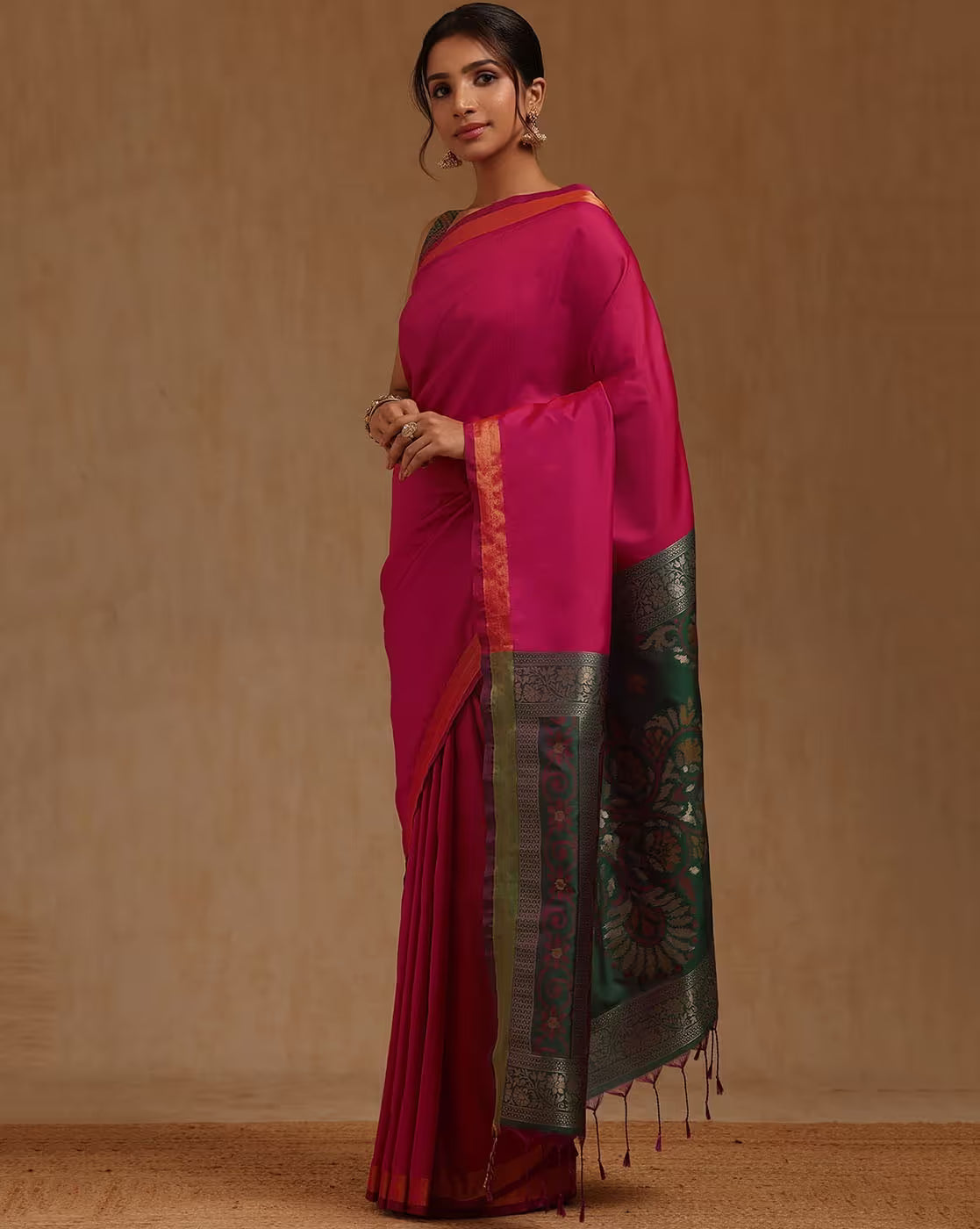 Front view of a Banarasi Kanjivaram Silk Saree USA in vibrant pink with intricate border, perfect for weddings.