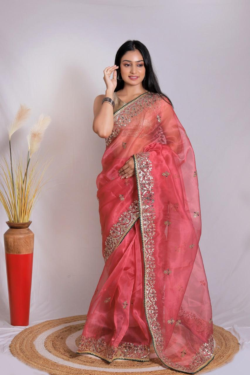 Front view of a pink Banarasi saree from aromie with intricate gold embroidery, perfect for weddings in Canada