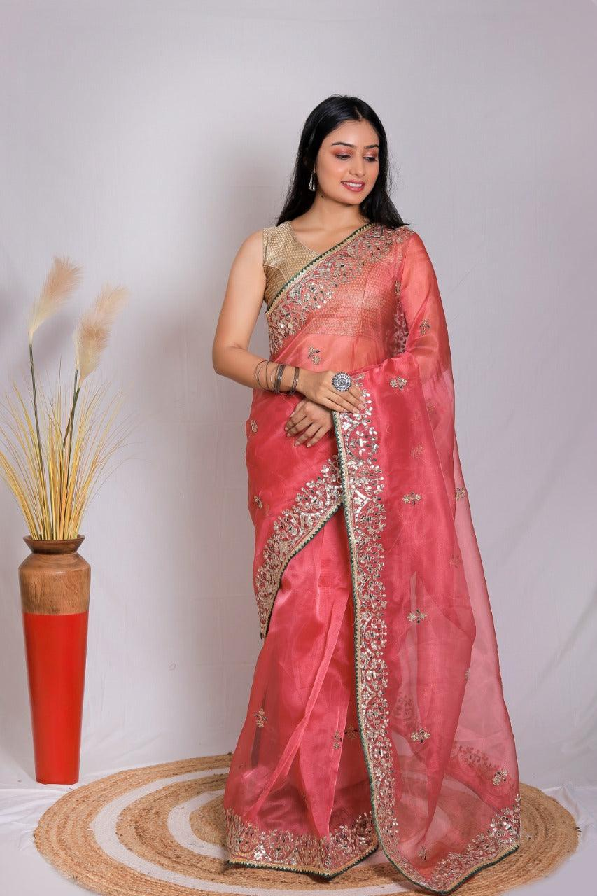 Elegant Banarasi saree in coral with intricate gold embroidery, ideal for weddings and festive occasions in Canada