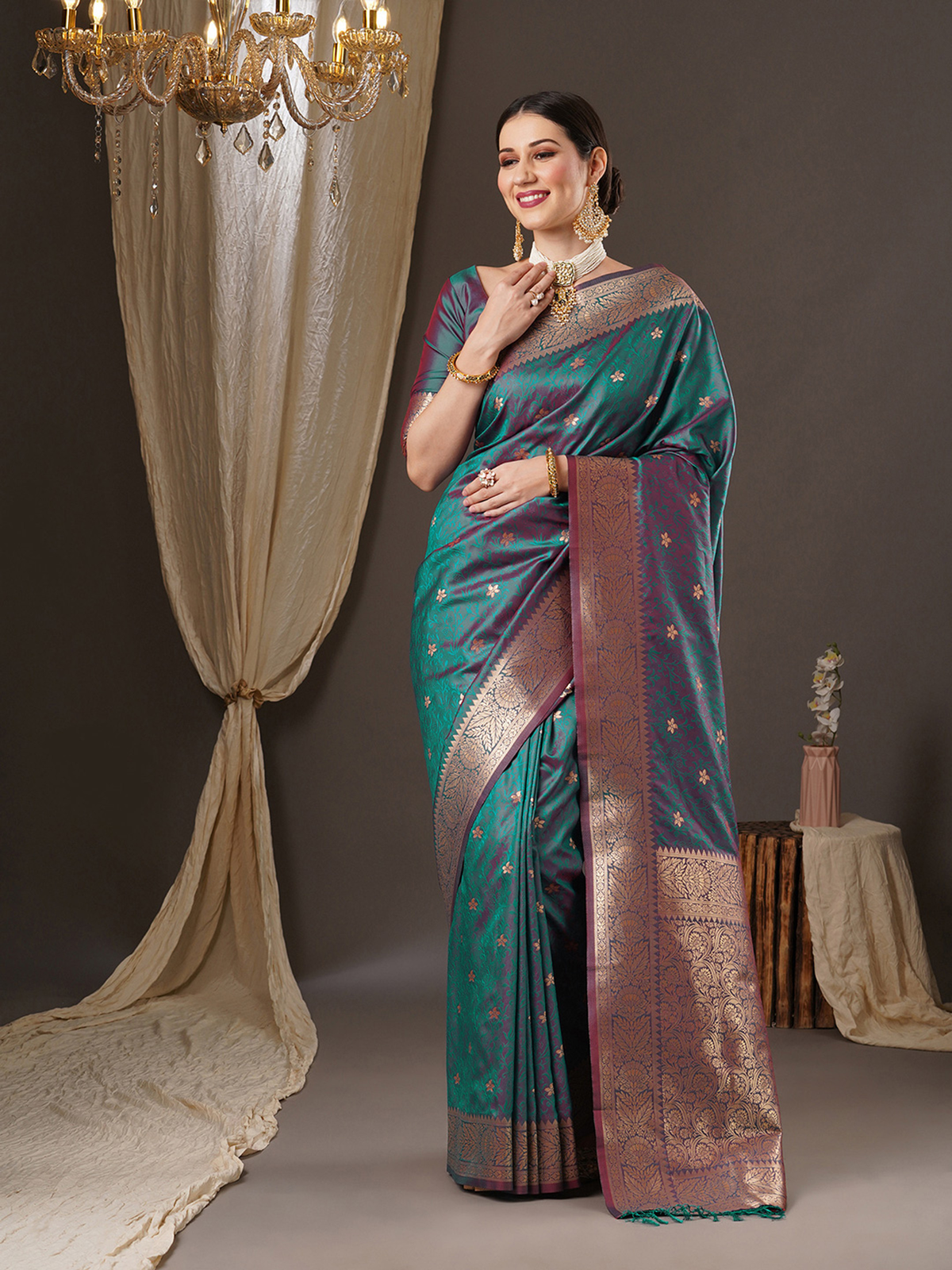 Front view of a teal Banarasi saree with intricate gold detailing, perfect for party wear in Canada