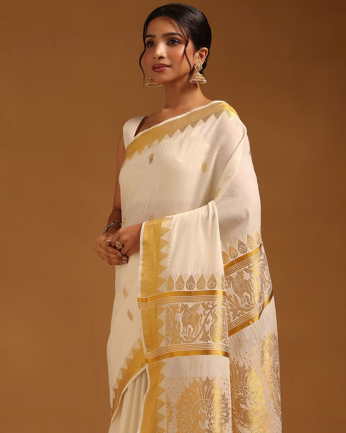 Elegant Banarasi Silk Saree Online in cream with gold detailing, perfect for weddings and special occasions