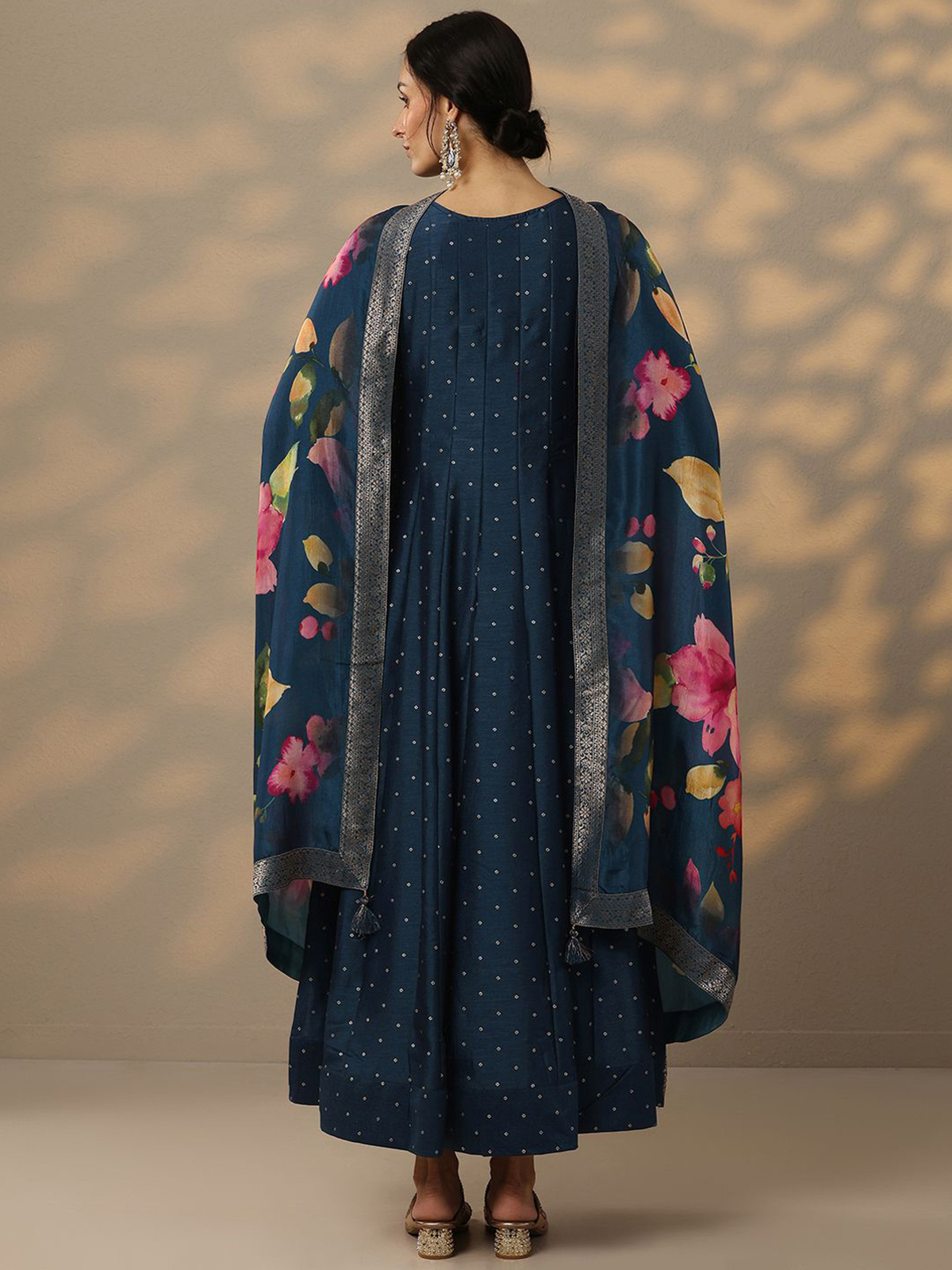 Elegant Bandhani silk gown with dupatta featuring floral designs and a contemporary silhouette