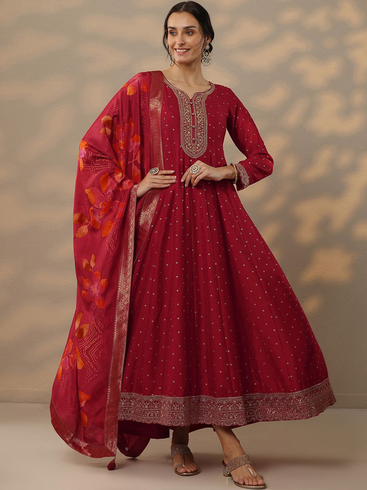 Aromie Bandhani silk gown with dupatta in vibrant red featuring elegant embroidery and floral designs