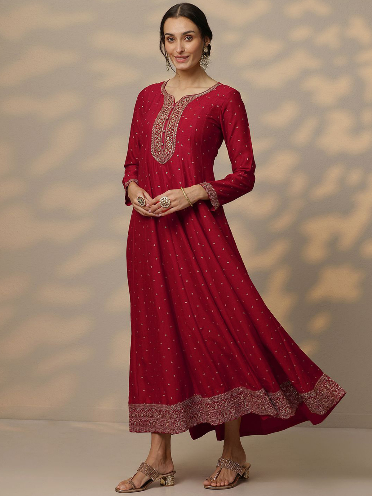 Elegant Bandhani silk gown with dupatta, featuring intricate embroidery and a flowing silhouette
