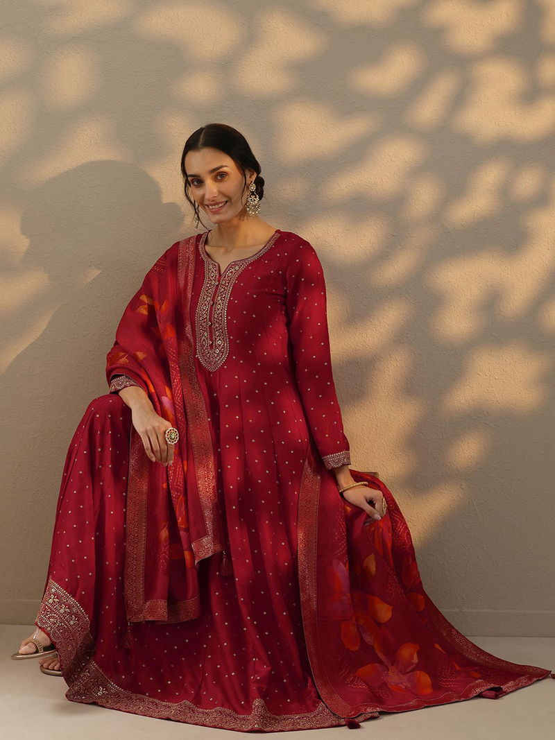 Aromie Bandhani silk gown with dupatta in deep red featuring intricate detailing and elegant design