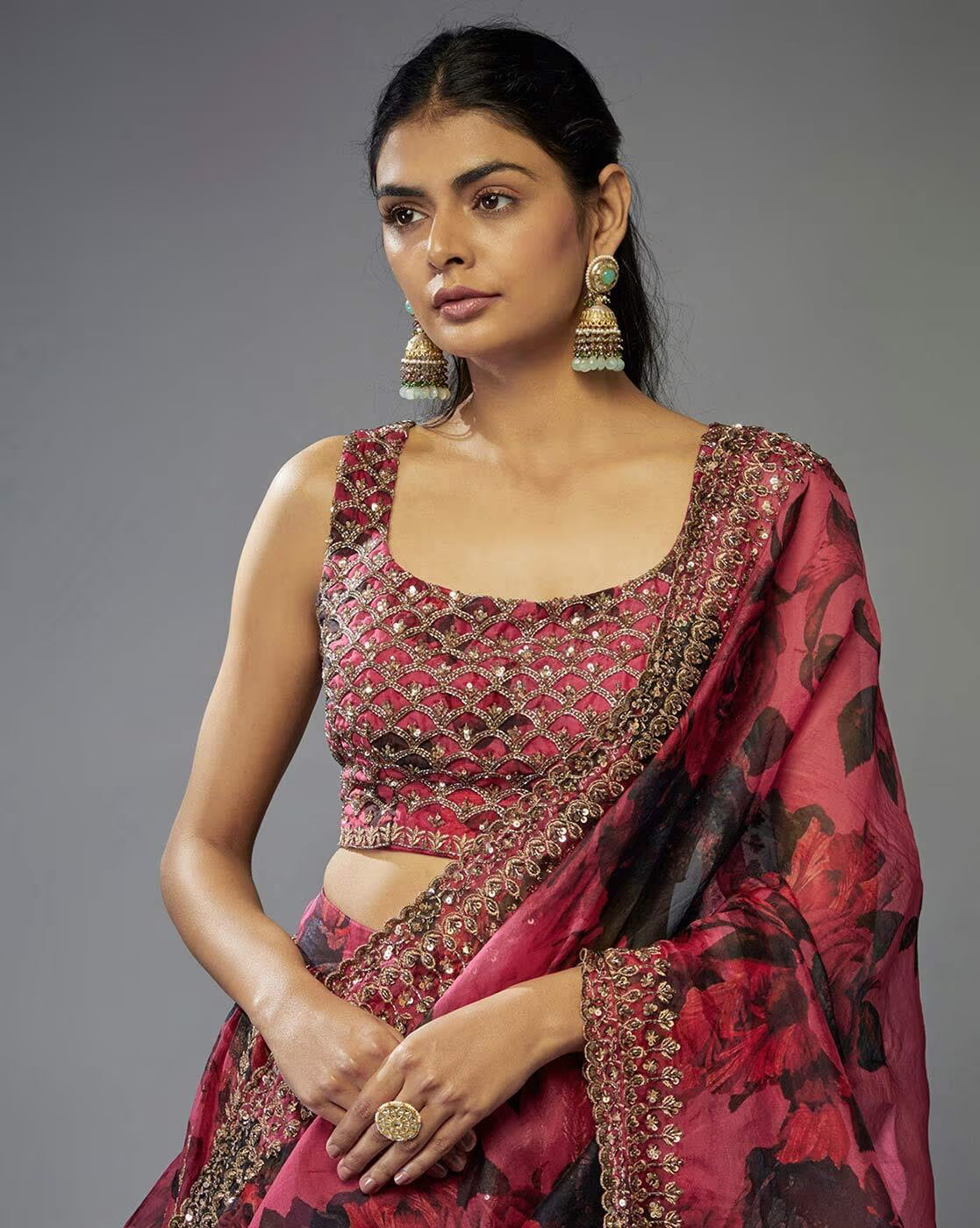 Model wearing maroon floral embroidered lehenga choli set Canada with sleeveless heavily embroidered blouse and embellished dupatta