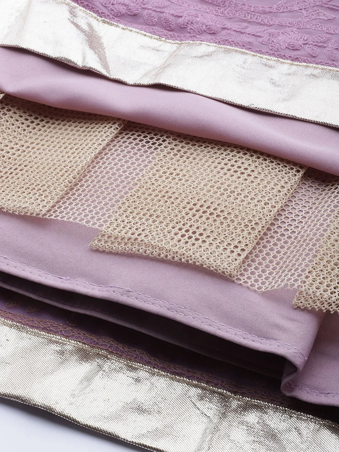 Detailed view of a lavender lehenga choli set USA with intricate lace and golden borders, perfect for weddings.