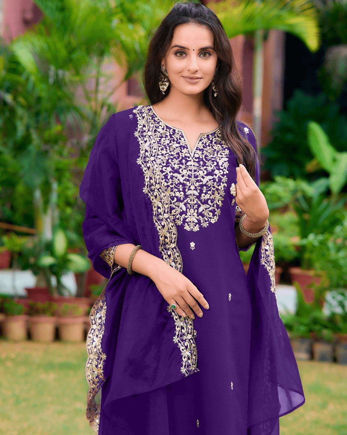 Elegant purple three piece kurta set with intricate embroidery, perfect for festive occasions